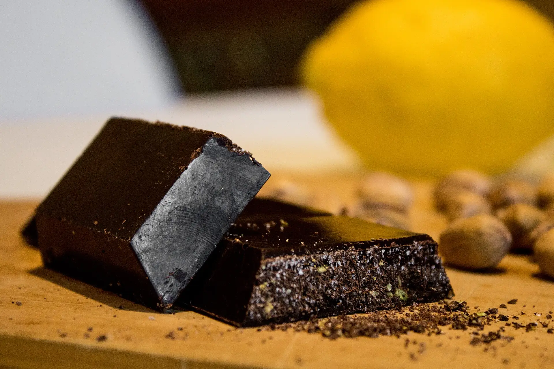 Bars of grainy dark Modica chocolate stacked on a counter